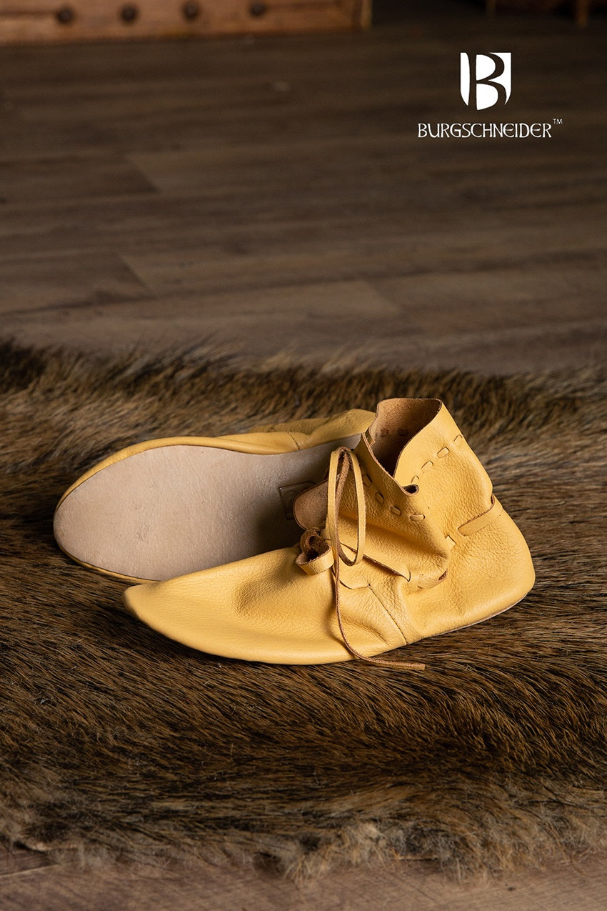 Light brown medieval shoes with lacing, showcasing a classic design suitable for reenactments and fairs.
