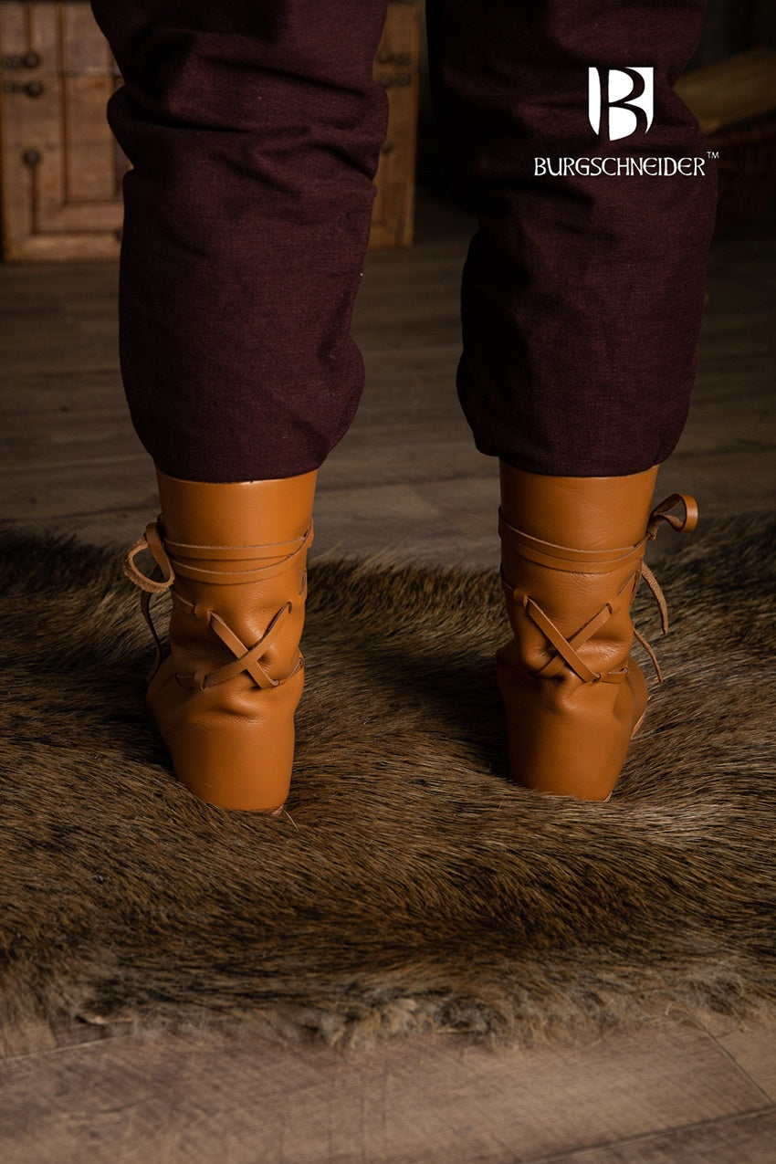 Brown leather Leonard medieval shoes with adjustable chord ties, showcasing a classic medieval boot design.