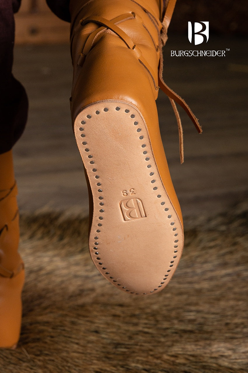 Brown leather Leonard medieval shoes with adjustable chord ties, showcasing a classic medieval boot design.
