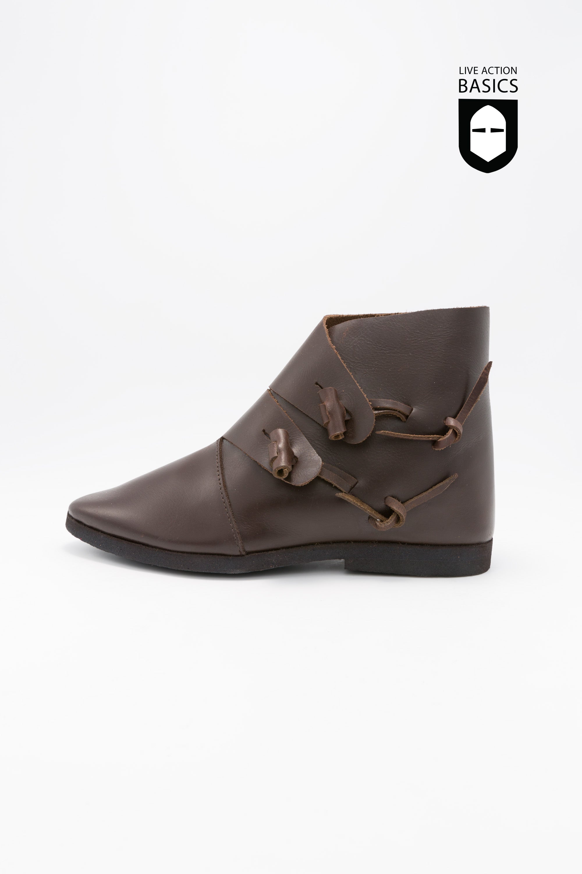 A pair of dark brown medieval shoes made from high-quality leather, featuring a cleated sole and leather strip fastening.