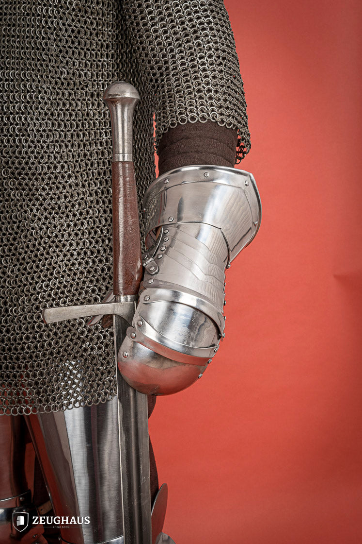 Polished 1.6mm steel Mitten Gauntlets with leather straps, showcasing elegant craftsmanship and layered construction.
