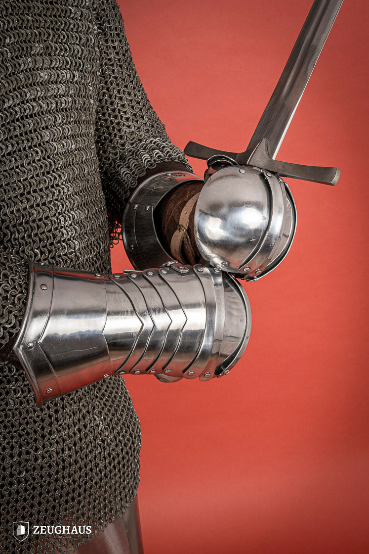 Polished 1.6mm steel Mitten Gauntlets with leather straps, showcasing elegant craftsmanship and layered construction.