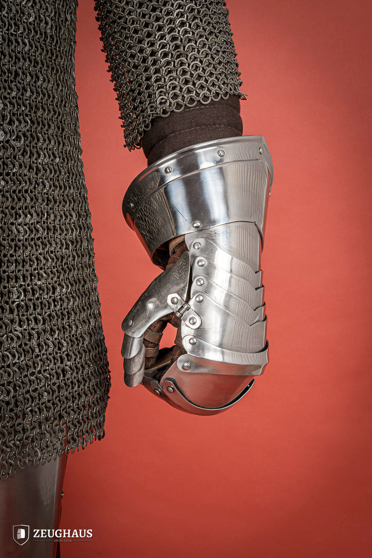 Polished 1.6mm steel Mitten Gauntlets with leather straps, showcasing elegant craftsmanship and layered construction.