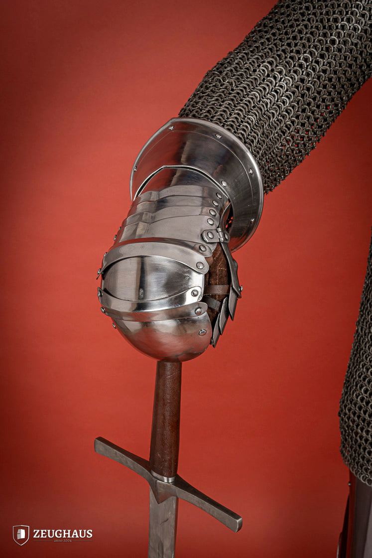 Polished 1.6mm steel Mitten Gauntlets with leather straps, showcasing elegant craftsmanship and layered construction.