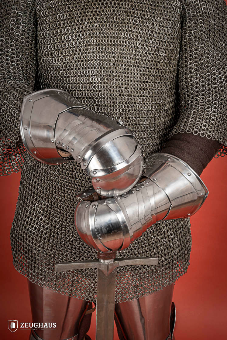 Polished 1.6mm steel Mitten Gauntlets with leather straps, showcasing elegant craftsmanship and layered construction.
