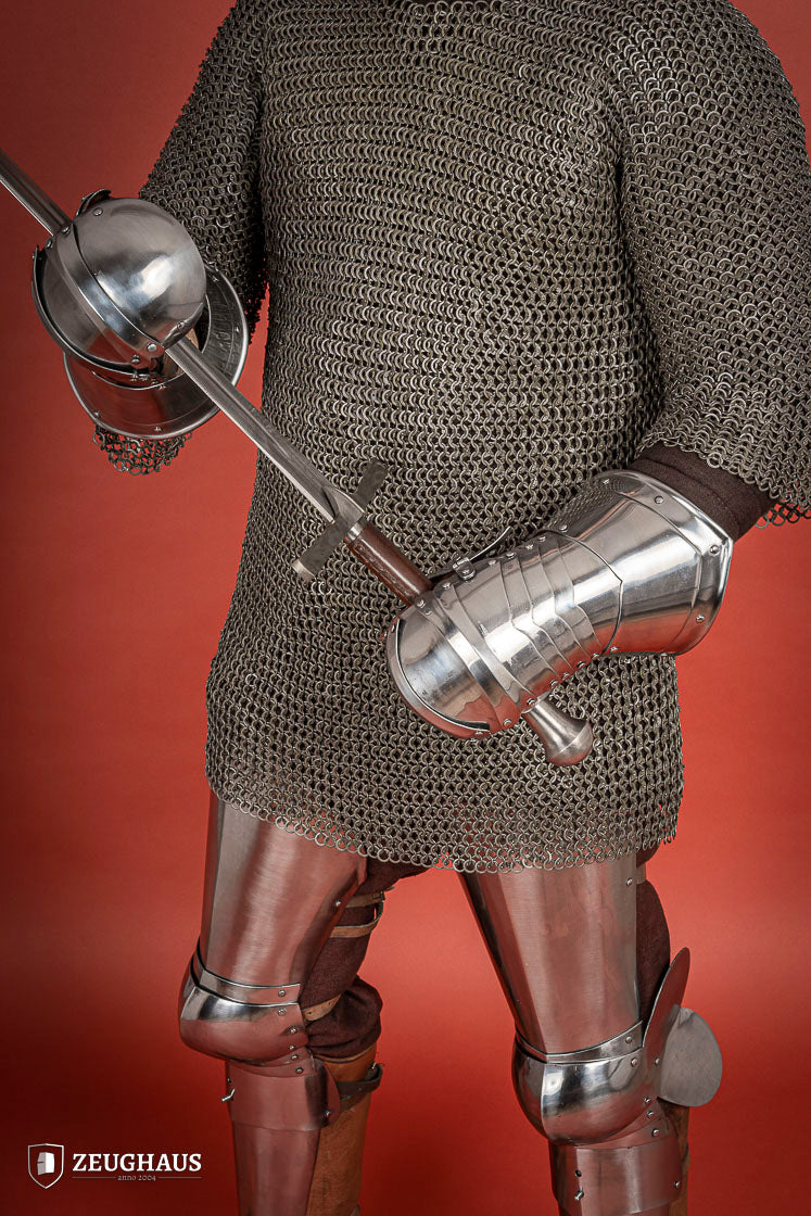 Polished 1.6mm steel Mitten Gauntlets with leather straps, showcasing elegant craftsmanship and layered construction.