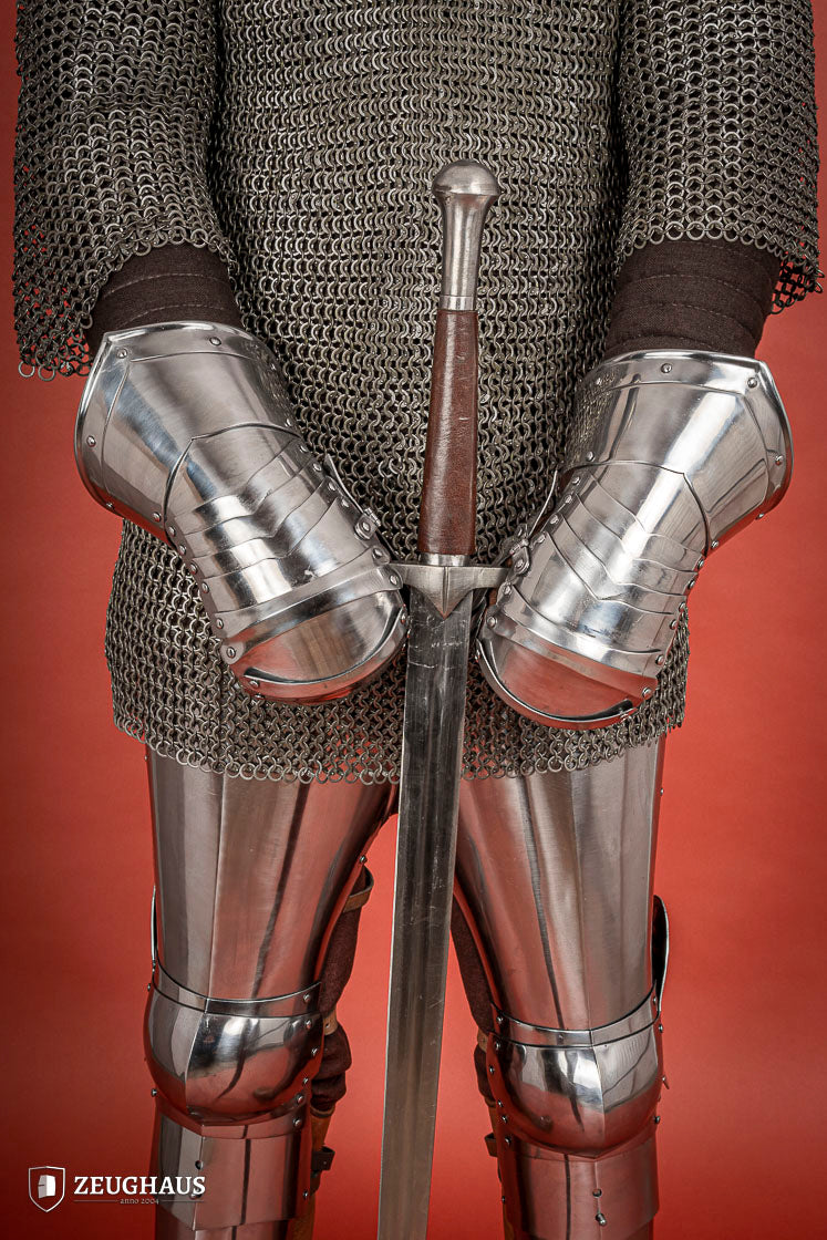 Polished 1.6mm steel Mitten Gauntlets with leather straps, showcasing elegant craftsmanship and layered construction.