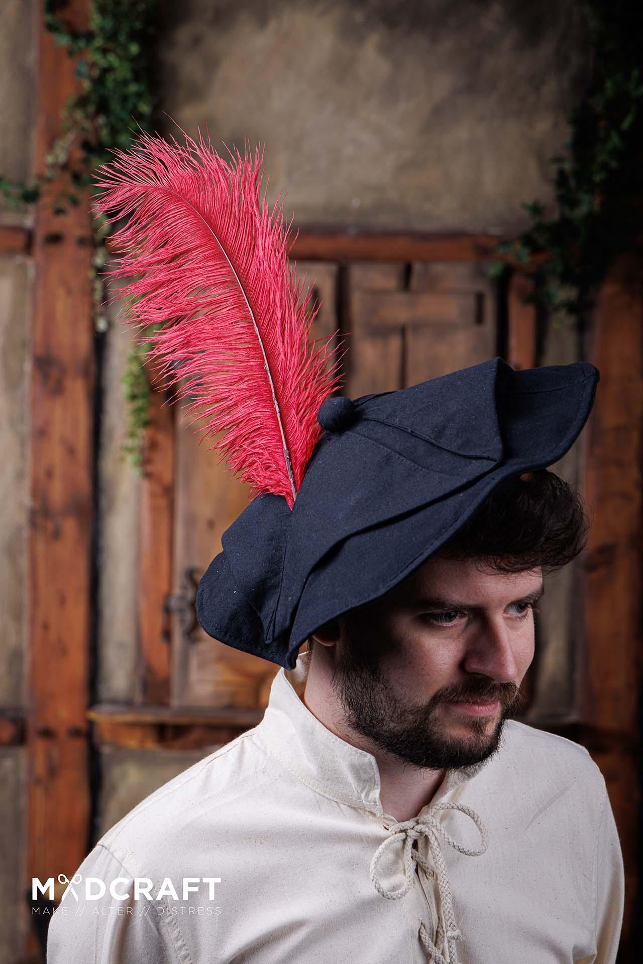 A collection of dark red ostrich feathers, measuring 45-50cm, showcasing their natural beauty and unique texture, perfect for medieval headwear.