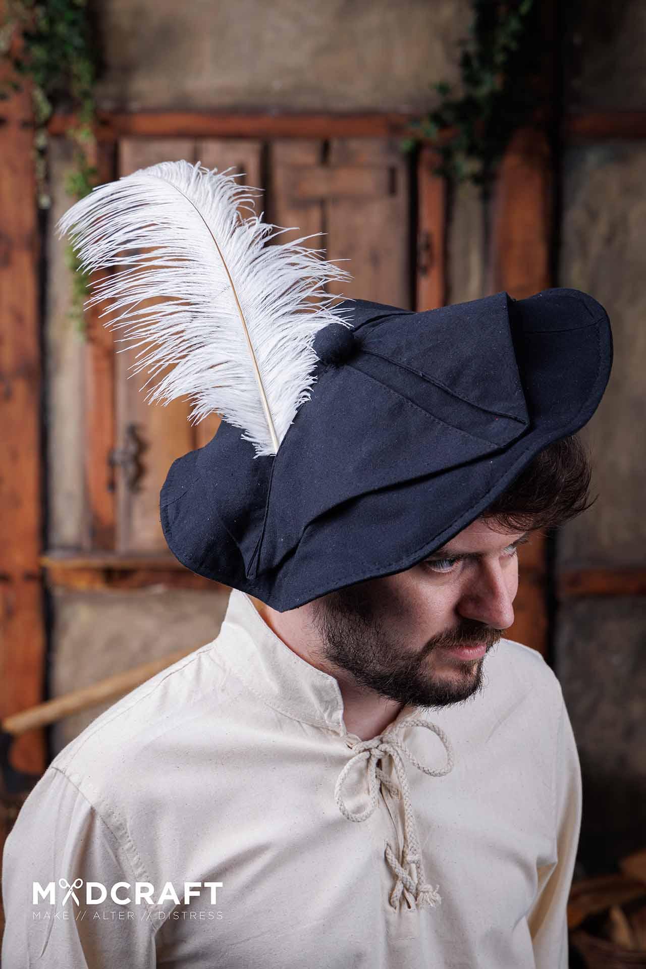 A collection of elegant white ostrich feathers, measuring 45-50cm, showcasing their natural texture and beauty, perfect for medieval-themed headwear.