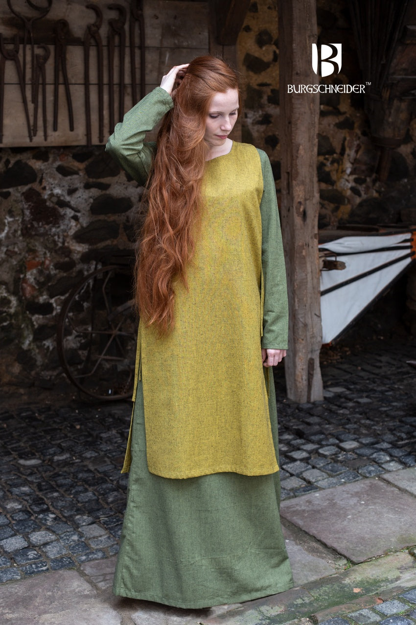 Over Dress Haithabu in Saffron Yellow, featuring lacing on both sides and made from robust, coarse woven cotton fabric.