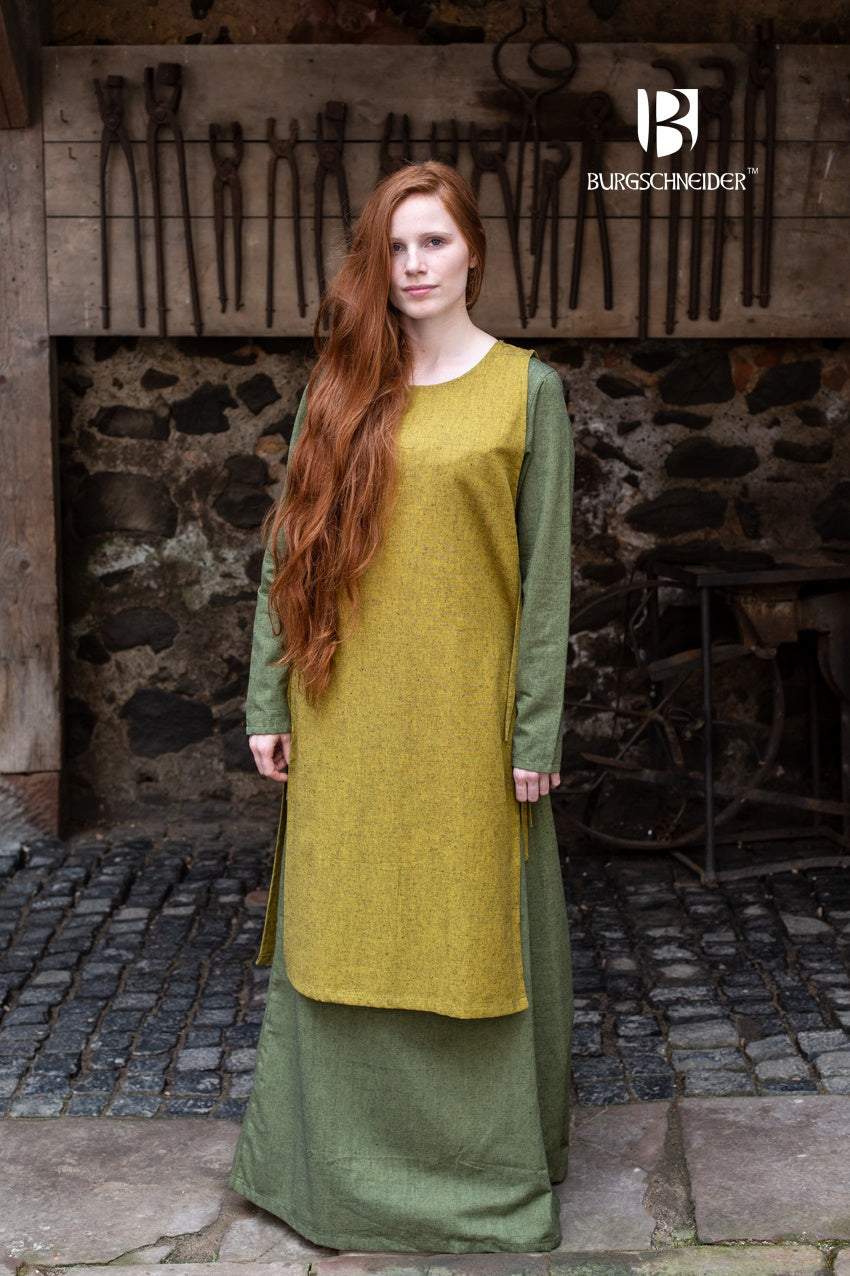 Over Dress Haithabu in Saffron Yellow, featuring lacing on both sides and made from robust, coarse woven cotton fabric.