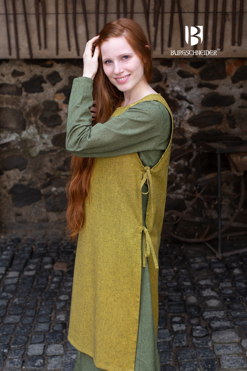 Over Dress Haithabu in Saffron Yellow, featuring lacing on both sides and made from robust, coarse woven cotton fabric.