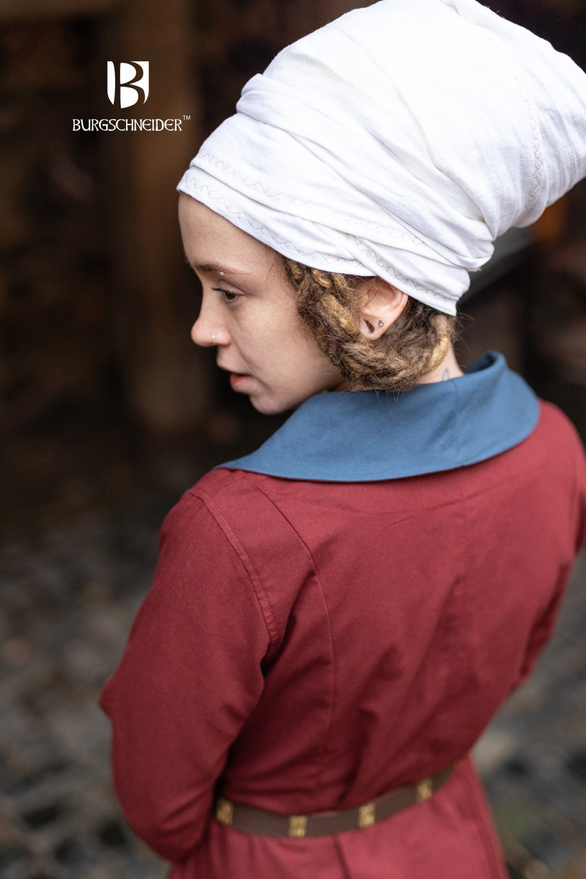 The Loretta Over Dress in Bordeaux and Woad Blue featuring a flared bottom, cuffed sleeves, and a stylish lapel neckline.