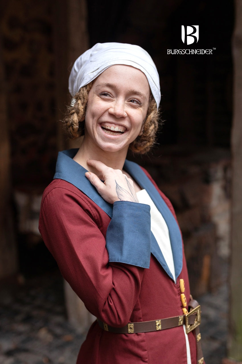 The Loretta Over Dress in Bordeaux and Woad Blue featuring a flared bottom, cuffed sleeves, and a stylish lapel neckline.