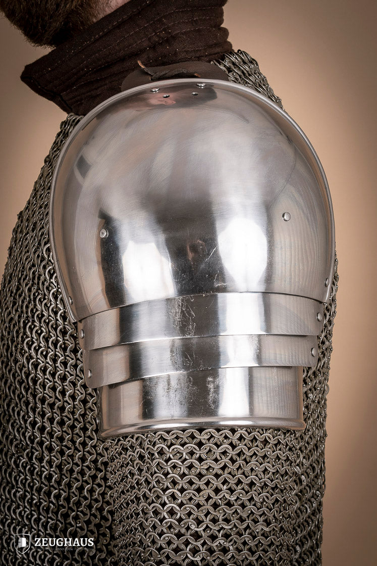 Polished 1460 pauldrons made of 1.6mm steel, showcasing a satin finish and handcrafted details for medieval armor enthusiasts.