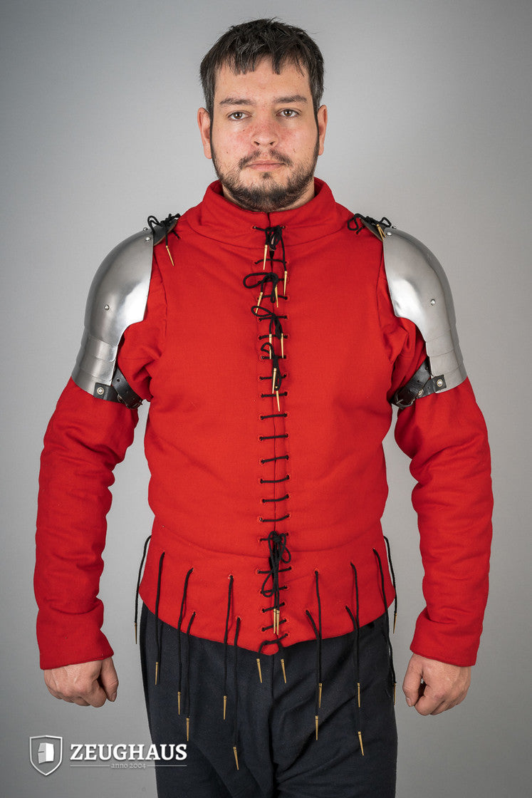 Polished 14th Century pauldrons made of 1.6mm steel, showcasing intricate design and sturdy leather cords for attachment.