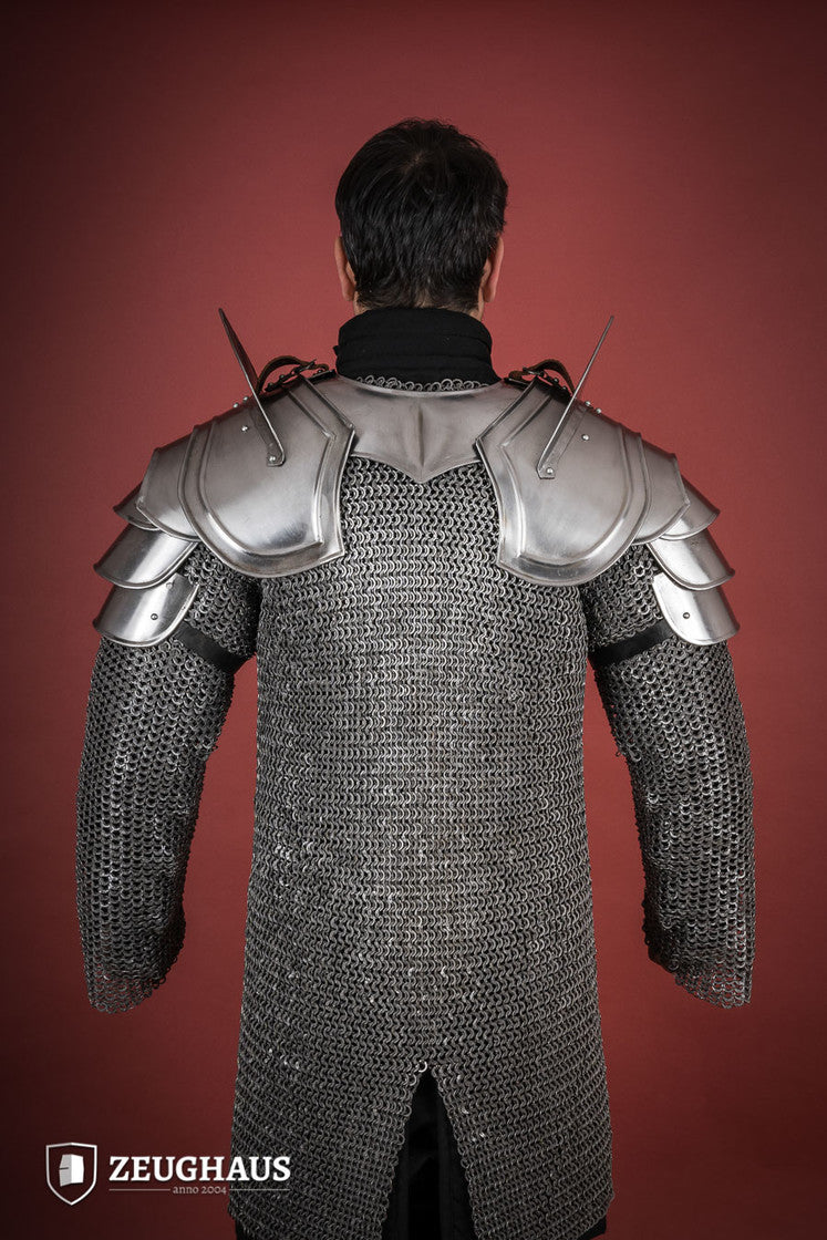 Polished Warrior Pauldrons featuring distinctive blade breakers, crafted from durable leather with a secure attachment system.