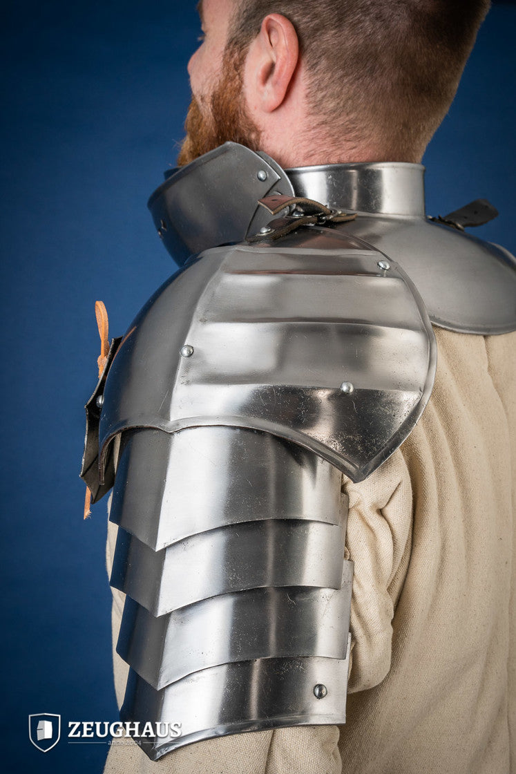 15th Century Pauldrons with Besagew, polished steel, featuring rosette-shaped hover discs and leather straps for secure fit.