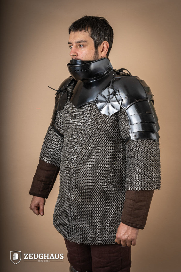 15th Century Pauldrons with Besagew, crafted from burnished steel with rosette-shaped hover discs for armpit protection.