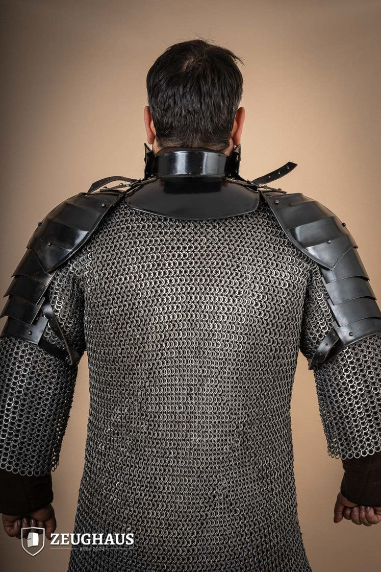 15th Century Pauldrons with Besagew, crafted from burnished steel with rosette-shaped hover discs for armpit protection.