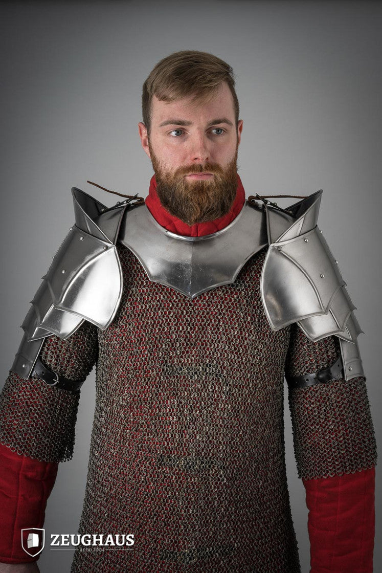Polished plate pauldrons with blade breakers, featuring flexible design and genuine leather straps for secure fit.