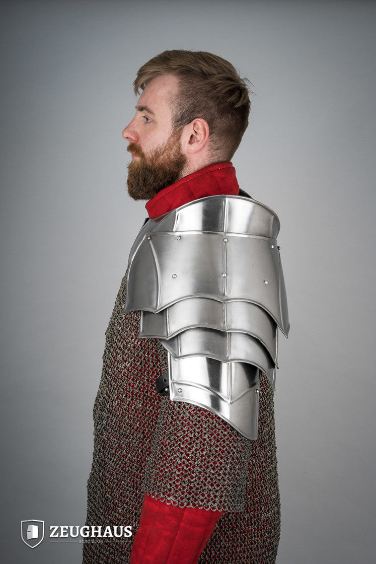 Polished plate pauldrons with blade breakers, featuring flexible design and genuine leather straps for secure fit.