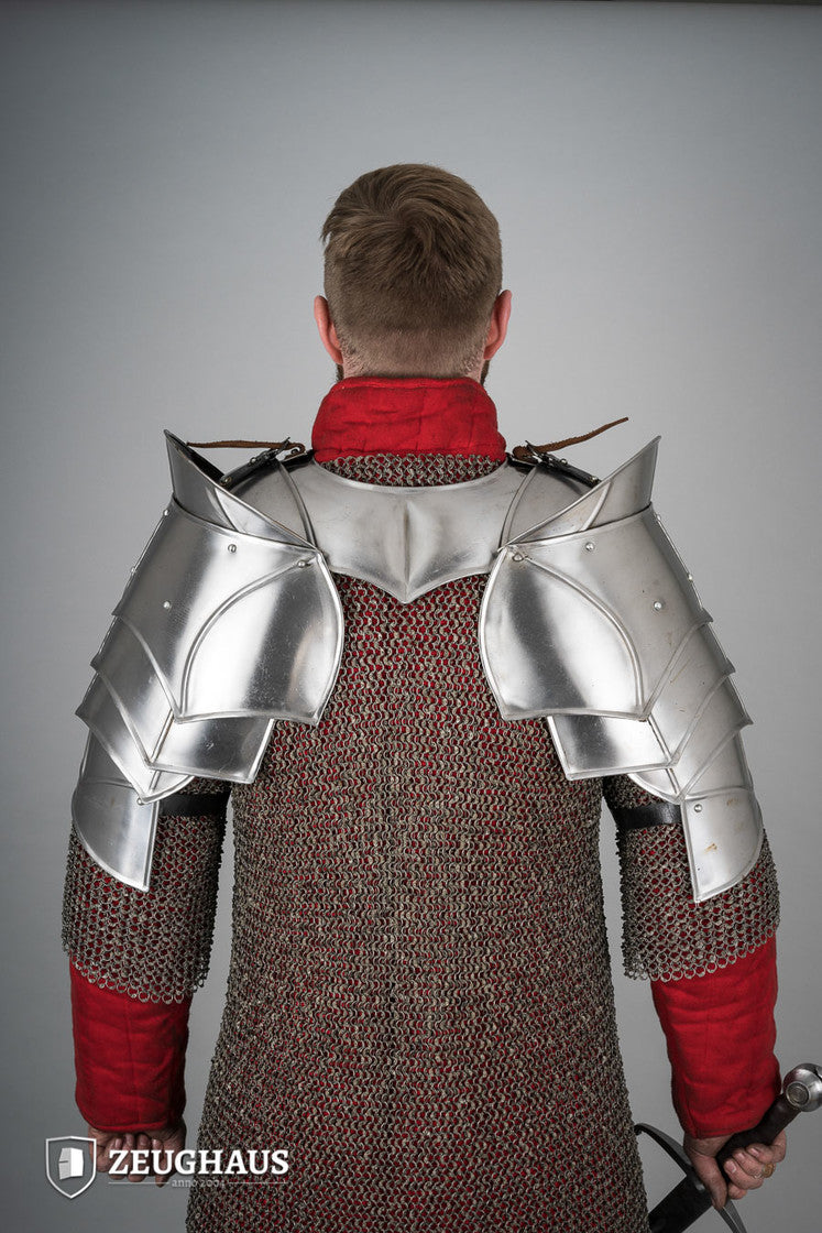 Polished plate pauldrons with blade breakers, featuring flexible design and genuine leather straps for secure fit.