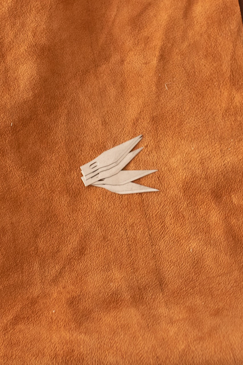 Five aluminum replacement blades for hobby knives, designed for precision cutting.