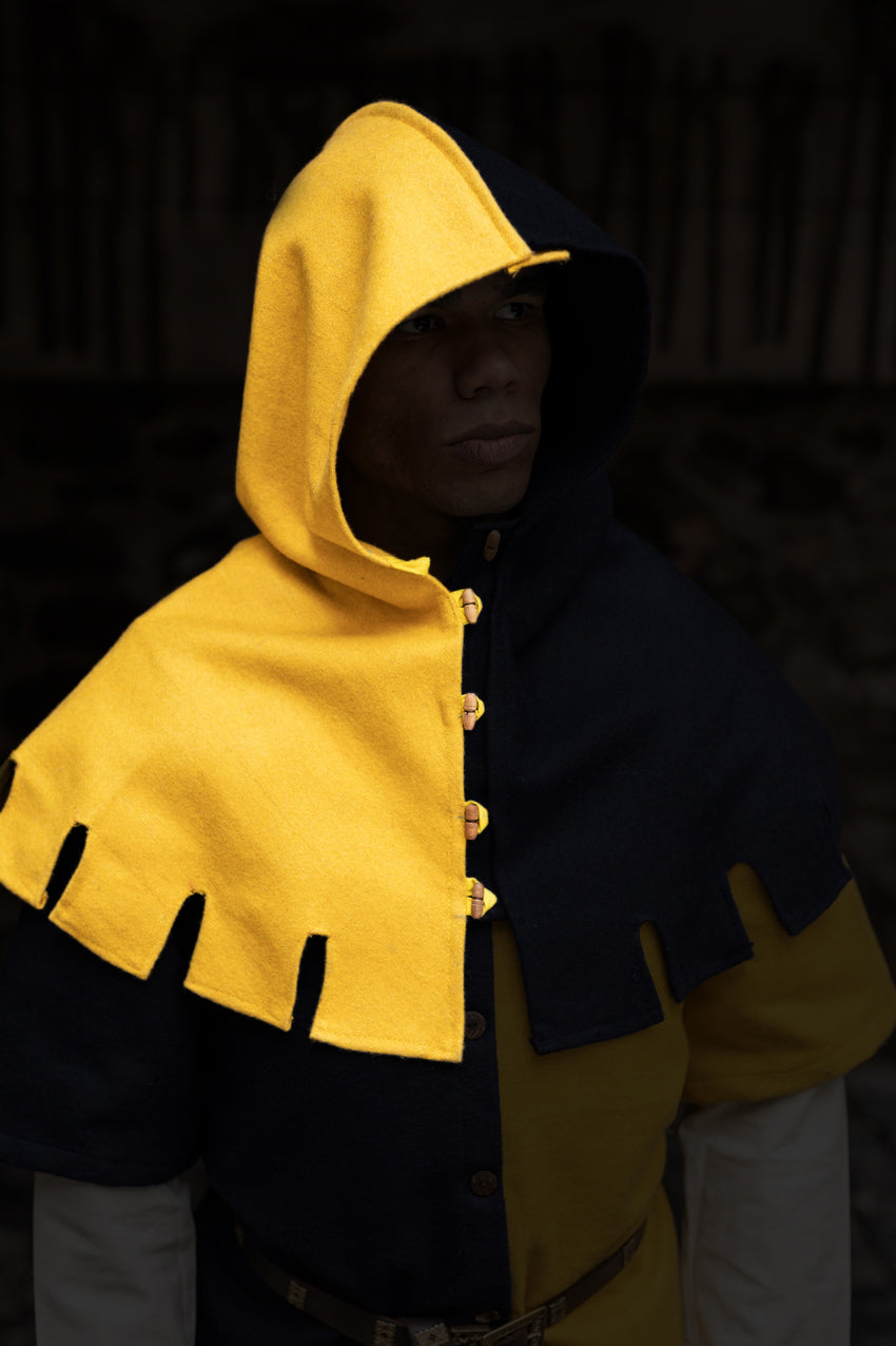 Right Side Cowl Dangereuse in vibrant yellow with rustic wooden buttons and elegant design, perfect for medieval-inspired fashion.