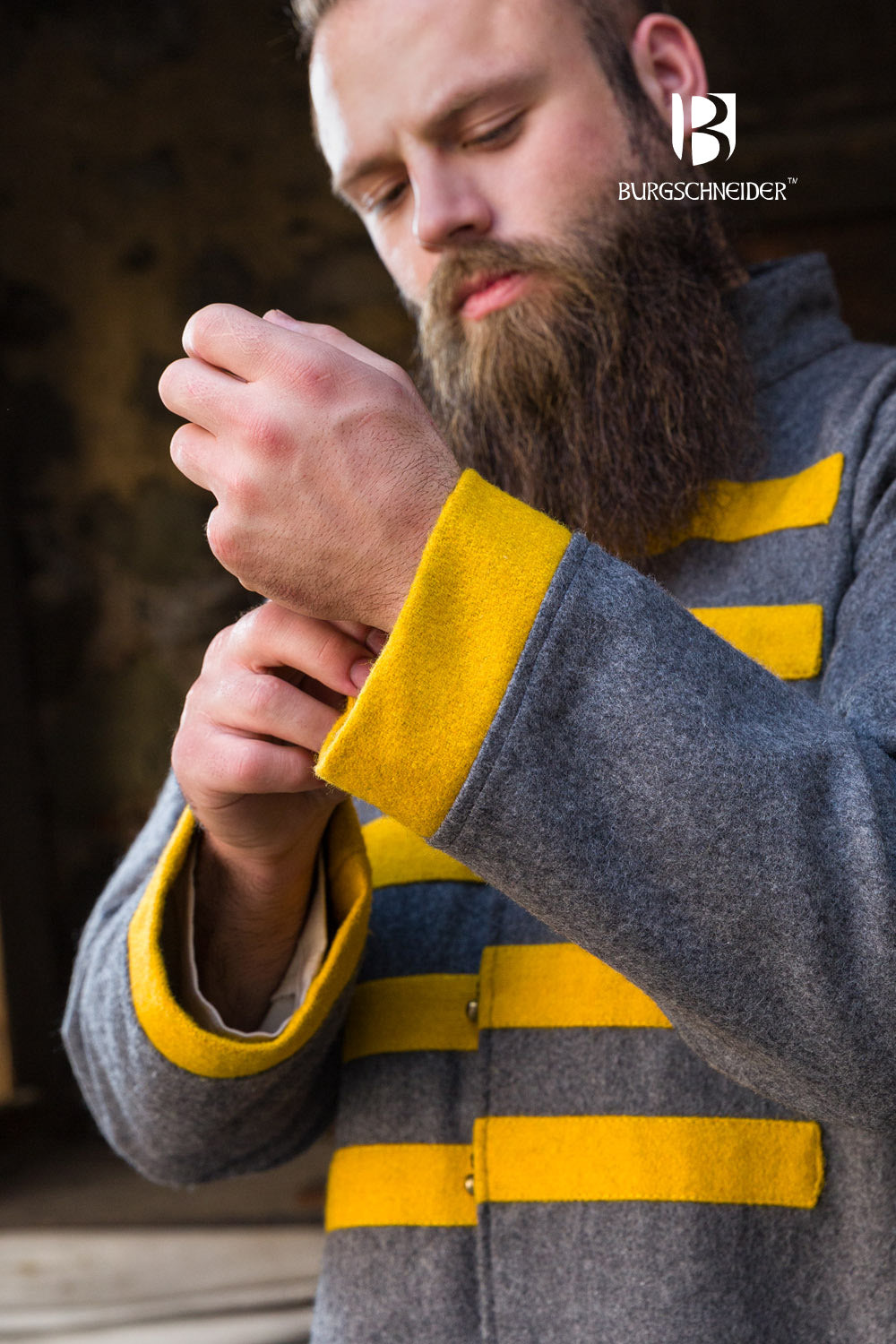 Bartosz Rus Coat in dark grey with vibrant yellow accents, featuring a standing collar and stylish buttons.