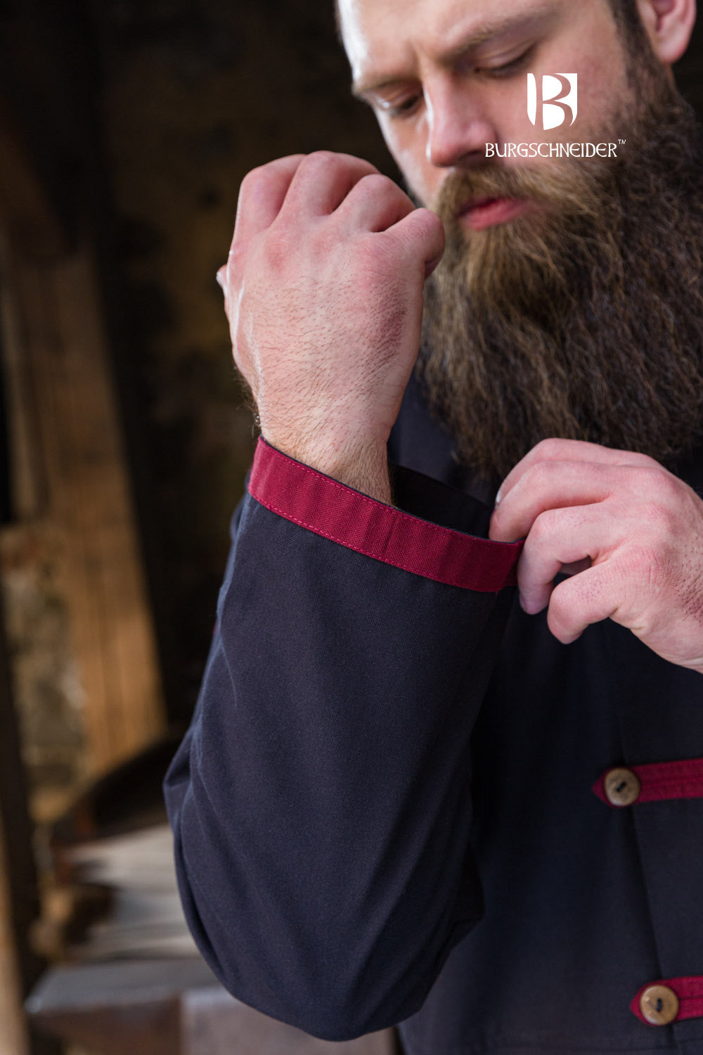 Jakub Rus Coat in Black with Bordeaux accents, featuring a lined standing collar and buttoned chest stripes.