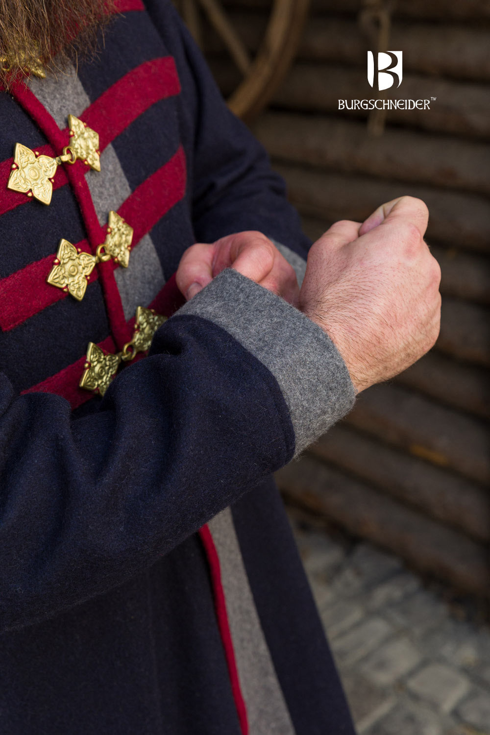 Kosma Rus Coat in Blue, Dark Grey, and Red with gold buckles and gray collar lining, showcasing elegant design and craftsmanship.