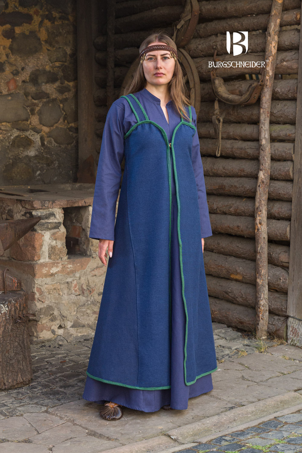 Katarzyna Rus Dress in blue with green edge binding, featuring over-the-shoulder straps and a button detail at the neckline.