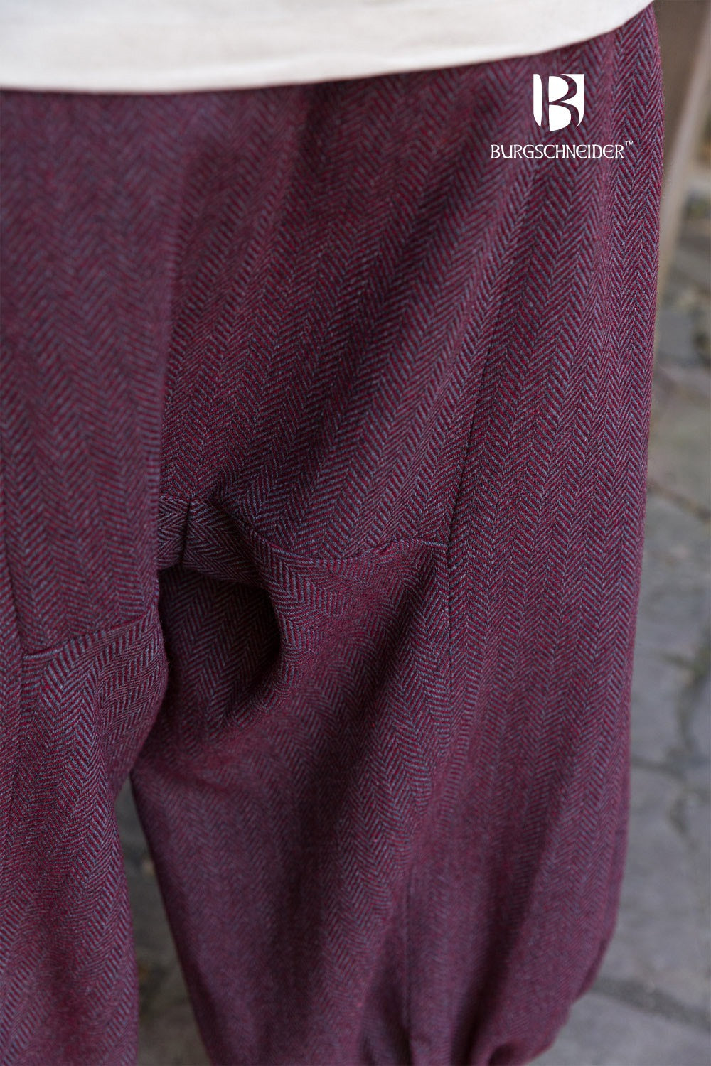 Rus Herringbone Pants in Burgundy and Grey with adjustable drawstrings and herringbone pattern, showcasing historical design.