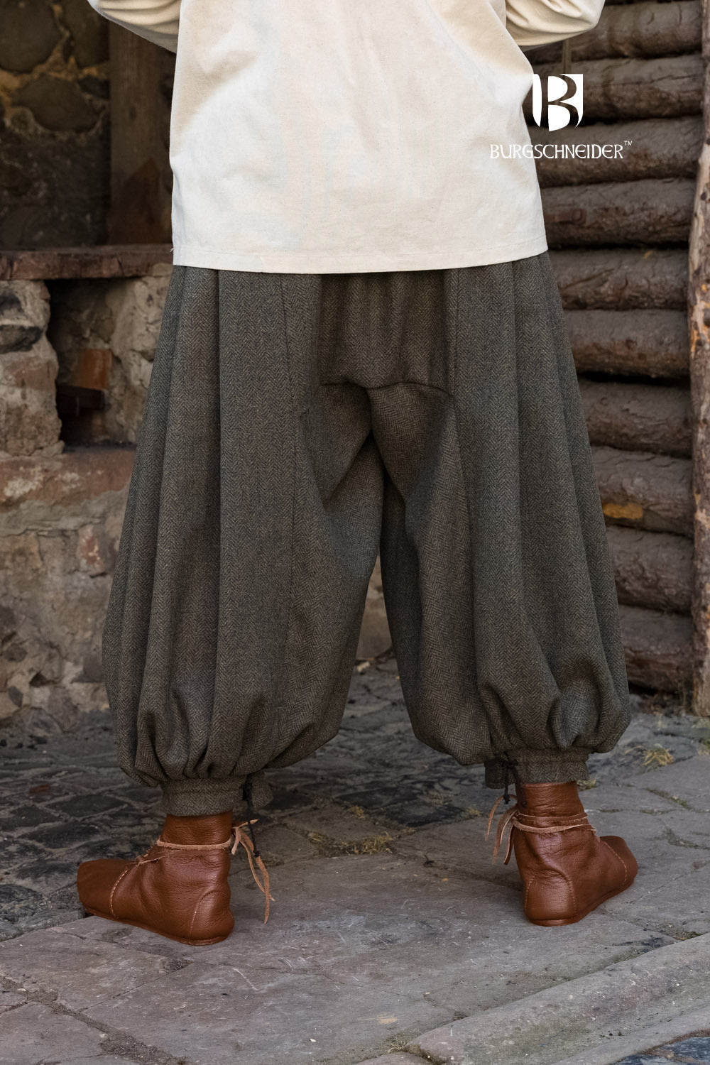 Rus Herringbone Pants in Olive/Grey featuring adjustable drawstrings and a unique herringbone pattern.