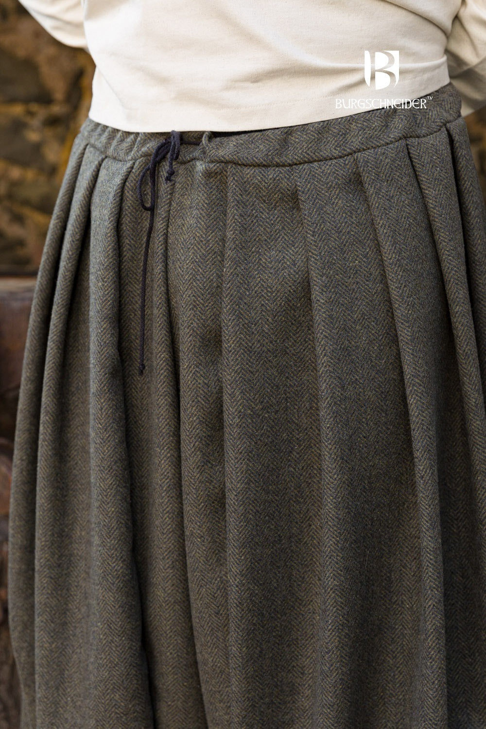 Rus Herringbone Pants in Olive/Grey featuring adjustable drawstrings and a unique herringbone pattern.