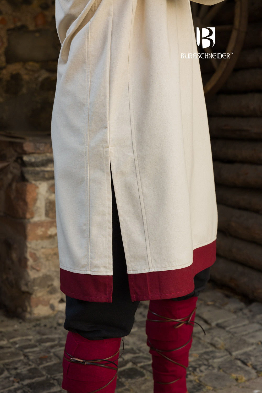 Tobiasz Rus Tunic in Natural color with Bordeaux accents on hem and collar, featuring side slits for mobility.