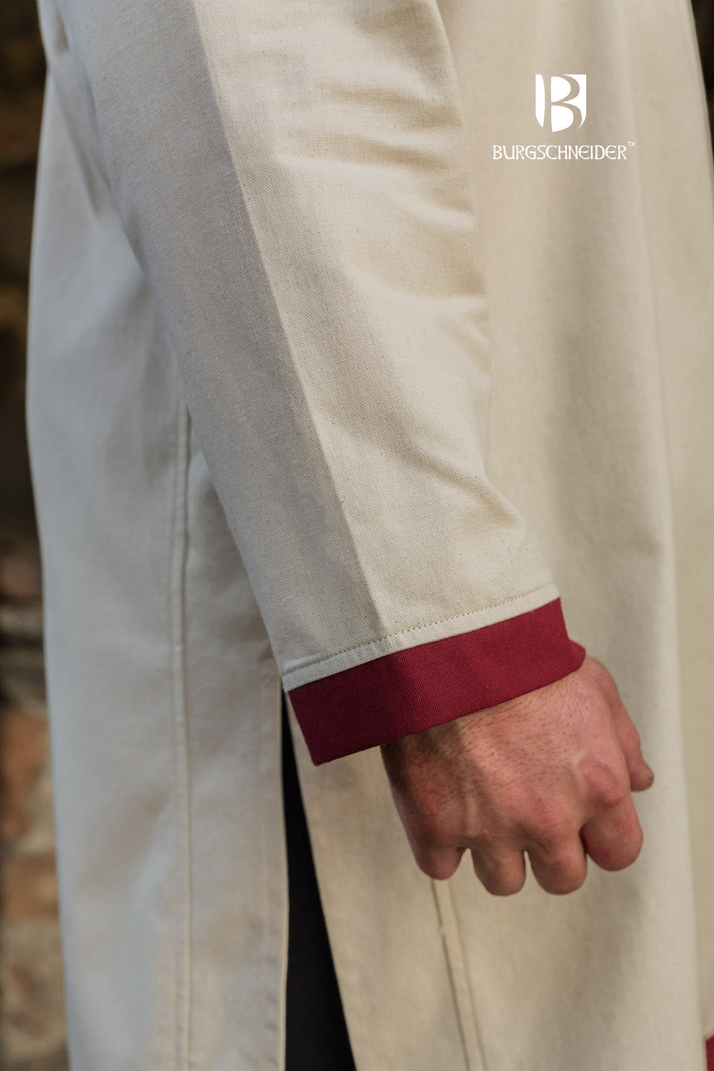 Tobiasz Rus Tunic in Natural color with Bordeaux accents on hem and collar, featuring side slits for mobility.