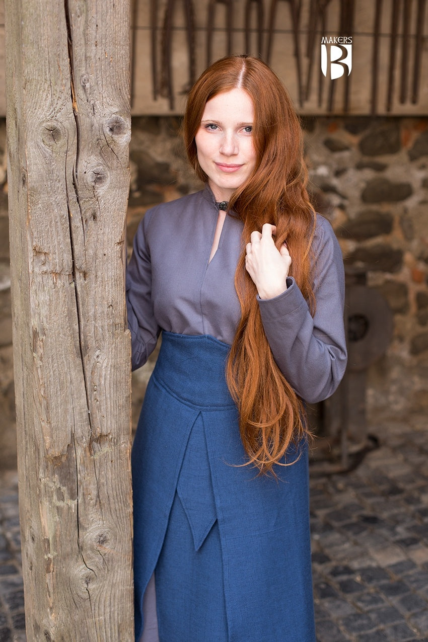 Tharya Blue Skirt featuring overlapping fabric panels, designed for noble roles, adjustable drawstring, and soft cotton material.