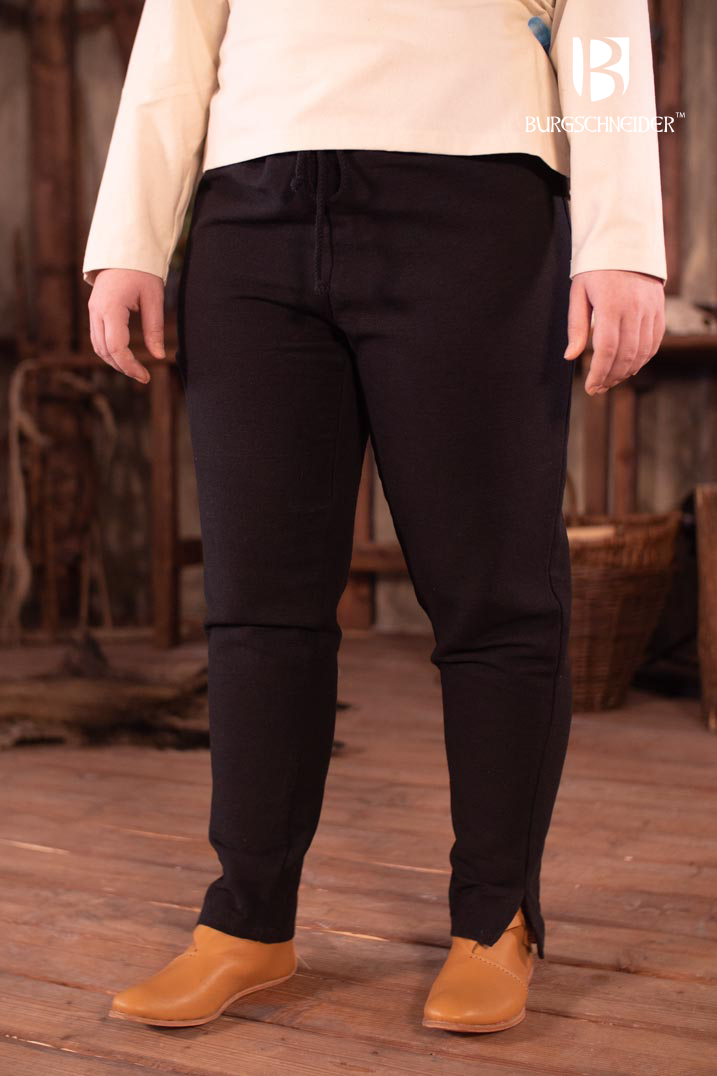 Skjoldehamn Pants Andoya in black, made from 100% cotton, featuring slits at the cuffs and a drawstring waistband for adjustable fit.