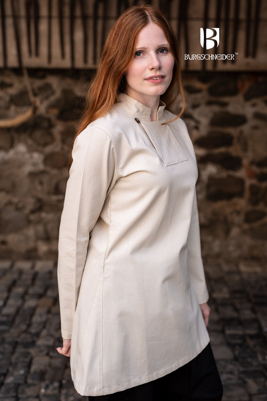 Skjoldehamn Tunic Lennja Natural, a long-sleeved cotton tunic with a buttoned collar, ideal for Norse reenactments and LARP events.