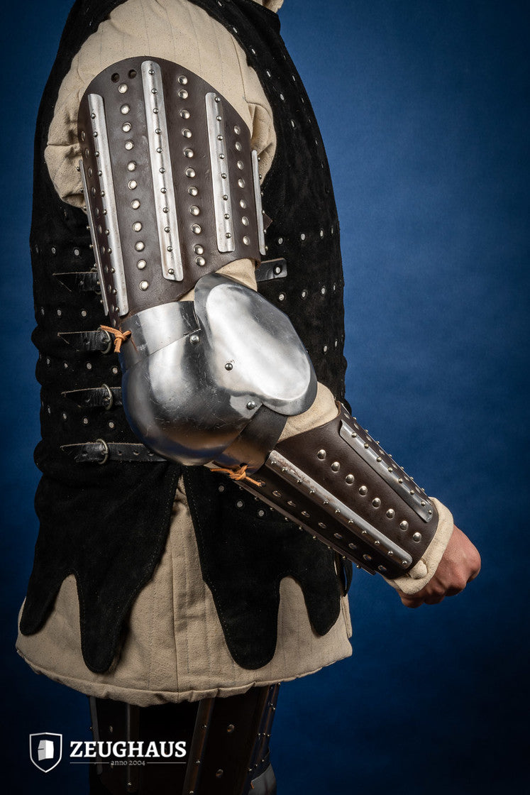 Splinted Arm Armour Brown made of dark brown leather with riveted steel plates, featuring vambrace, couter, and rerebrace components.