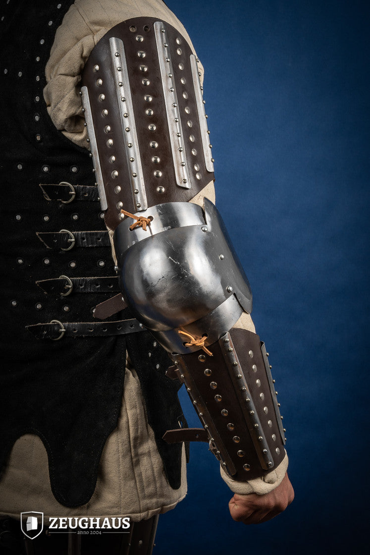 Splinted Arm Armour Brown made of dark brown leather with riveted steel plates, featuring vambrace, couter, and rerebrace components.