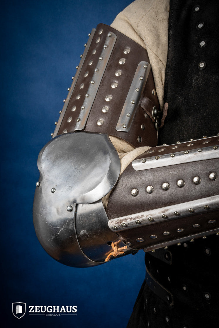 Splinted Arm Armour Brown made of dark brown leather with riveted steel plates, featuring vambrace, couter, and rerebrace components.