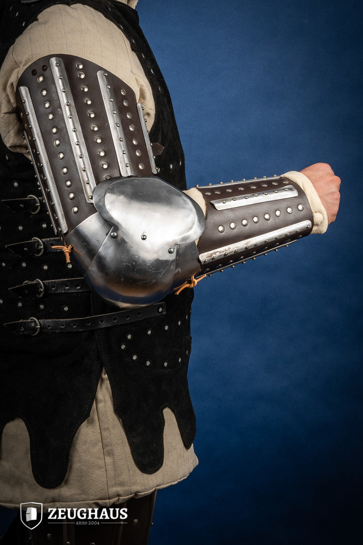 Splinted Arm Armour Brown made of dark brown leather with riveted steel plates, featuring vambrace, couter, and rerebrace components.