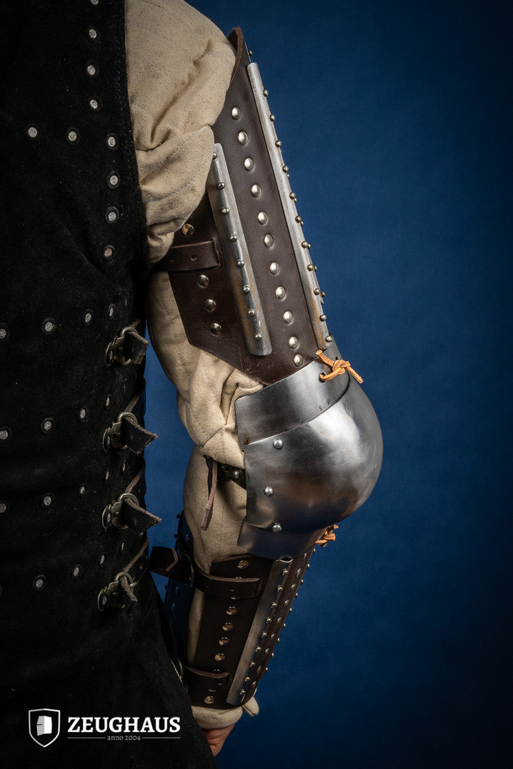 Splinted Arm Armour Brown made of dark brown leather with riveted steel plates, featuring vambrace, couter, and rerebrace components.