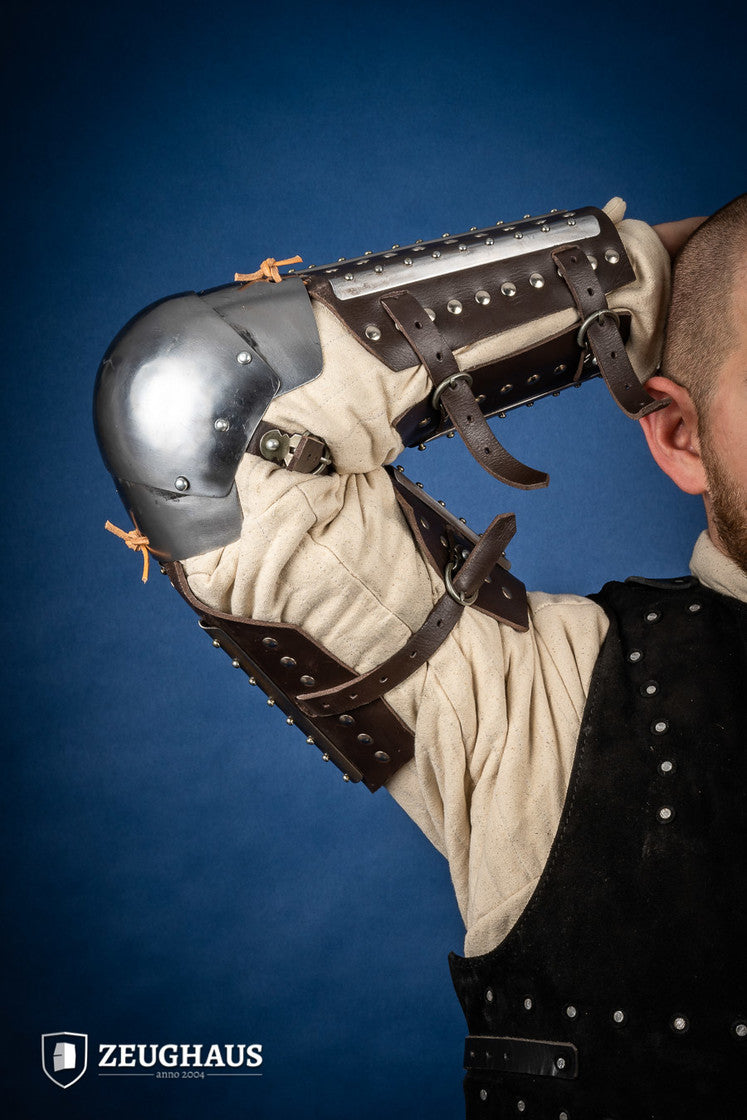 Splinted Arm Armour Brown made of dark brown leather with riveted steel plates, featuring vambrace, couter, and rerebrace components.