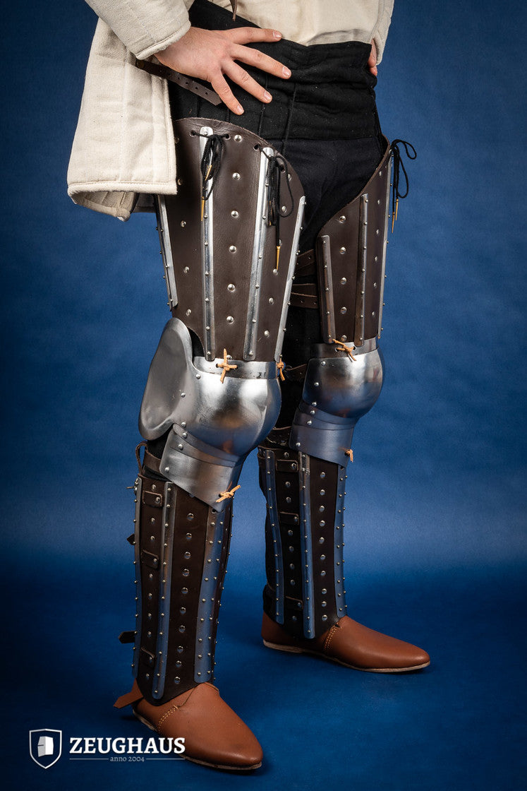 Splinted Leg Armor Brown featuring studded leather and steel strips, designed for historical reenactments and protection during battle.