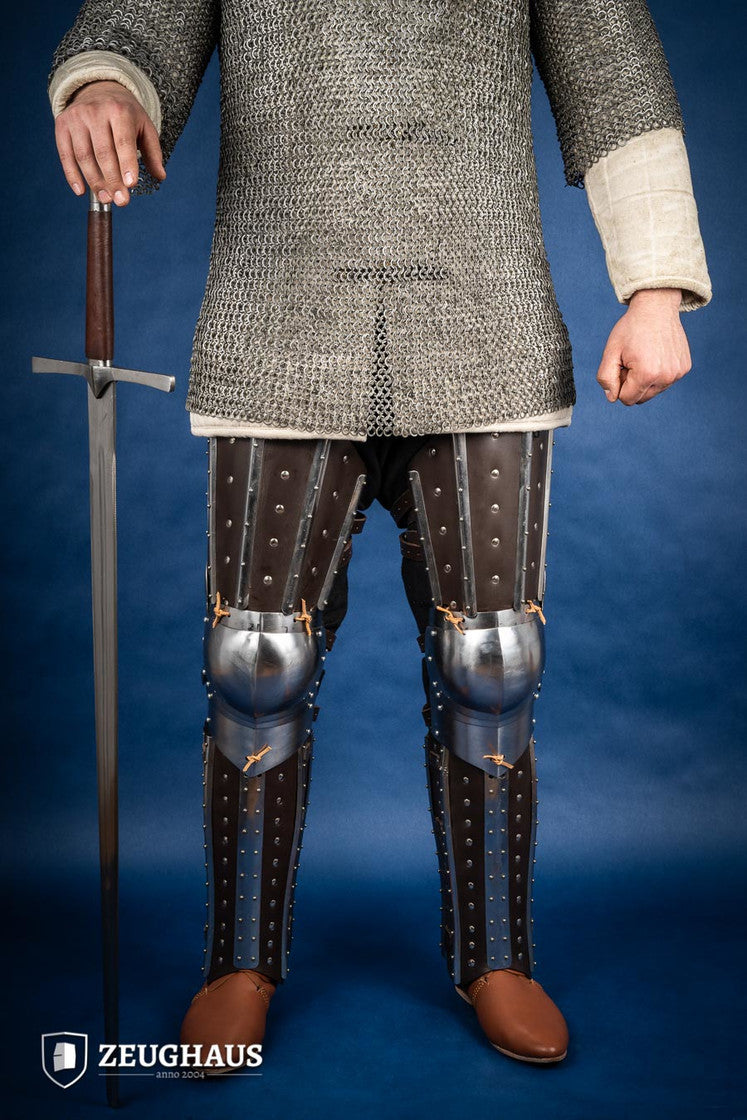 Splinted Leg Armor Brown featuring studded leather and steel strips, designed for historical reenactments and protection during battle.