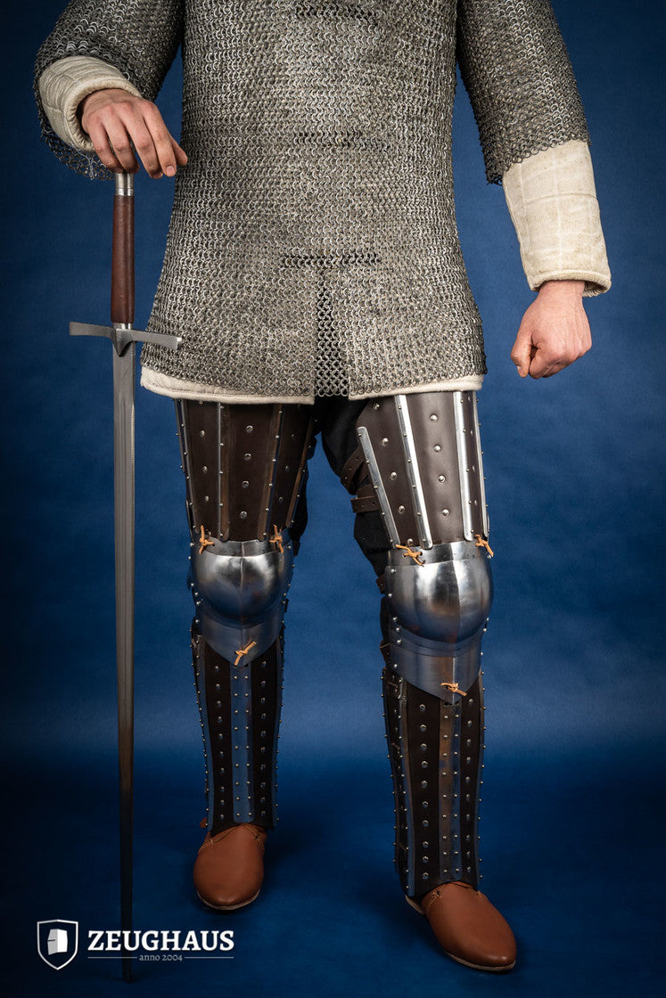 Splinted Leg Armor Brown featuring studded leather and steel strips, designed for historical reenactments and protection during battle.